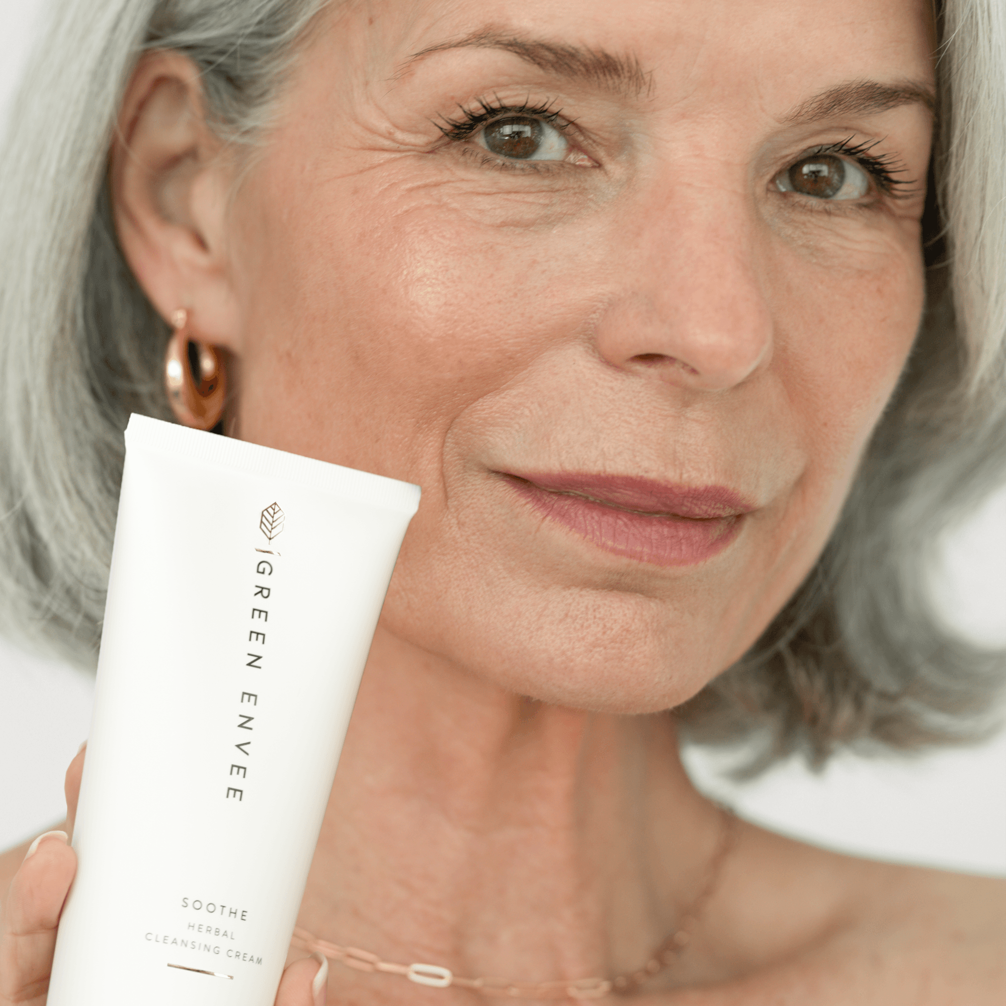 Woman holding Soothe Herbal Cleansing Cream
